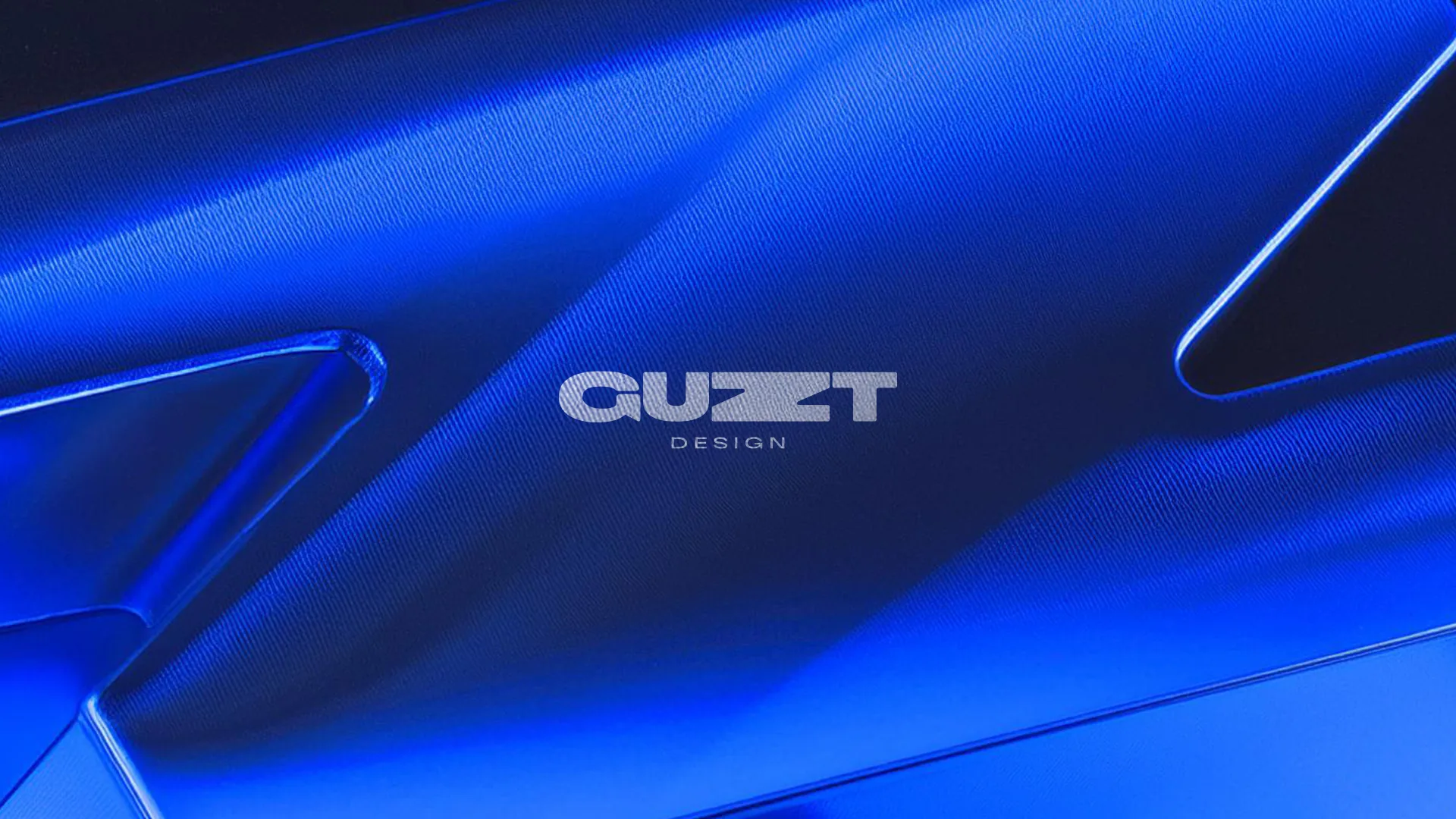 GUZT Design logo over blue glass
